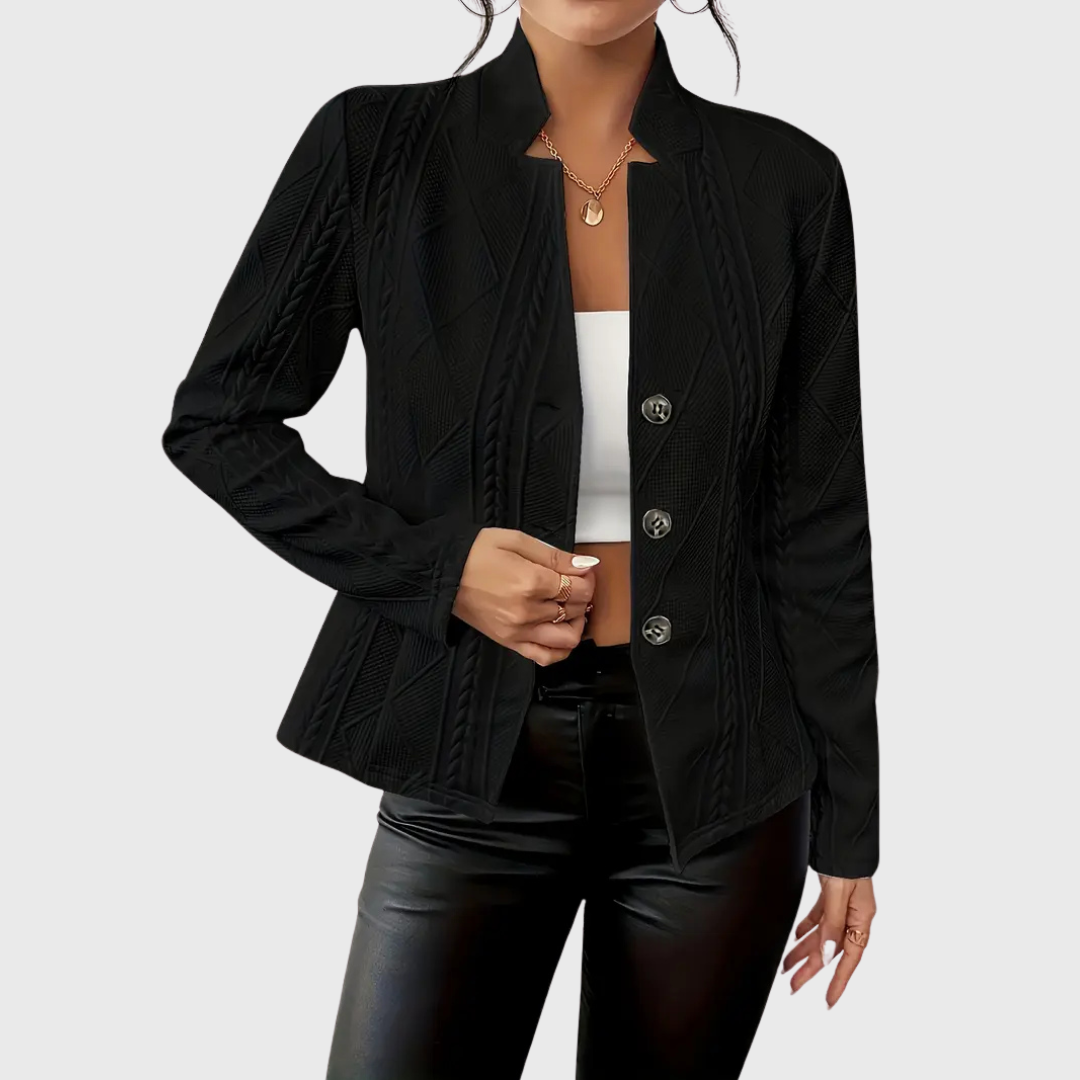 Close-up of the classic button fastening on a sophisticated women's tailored blazer

