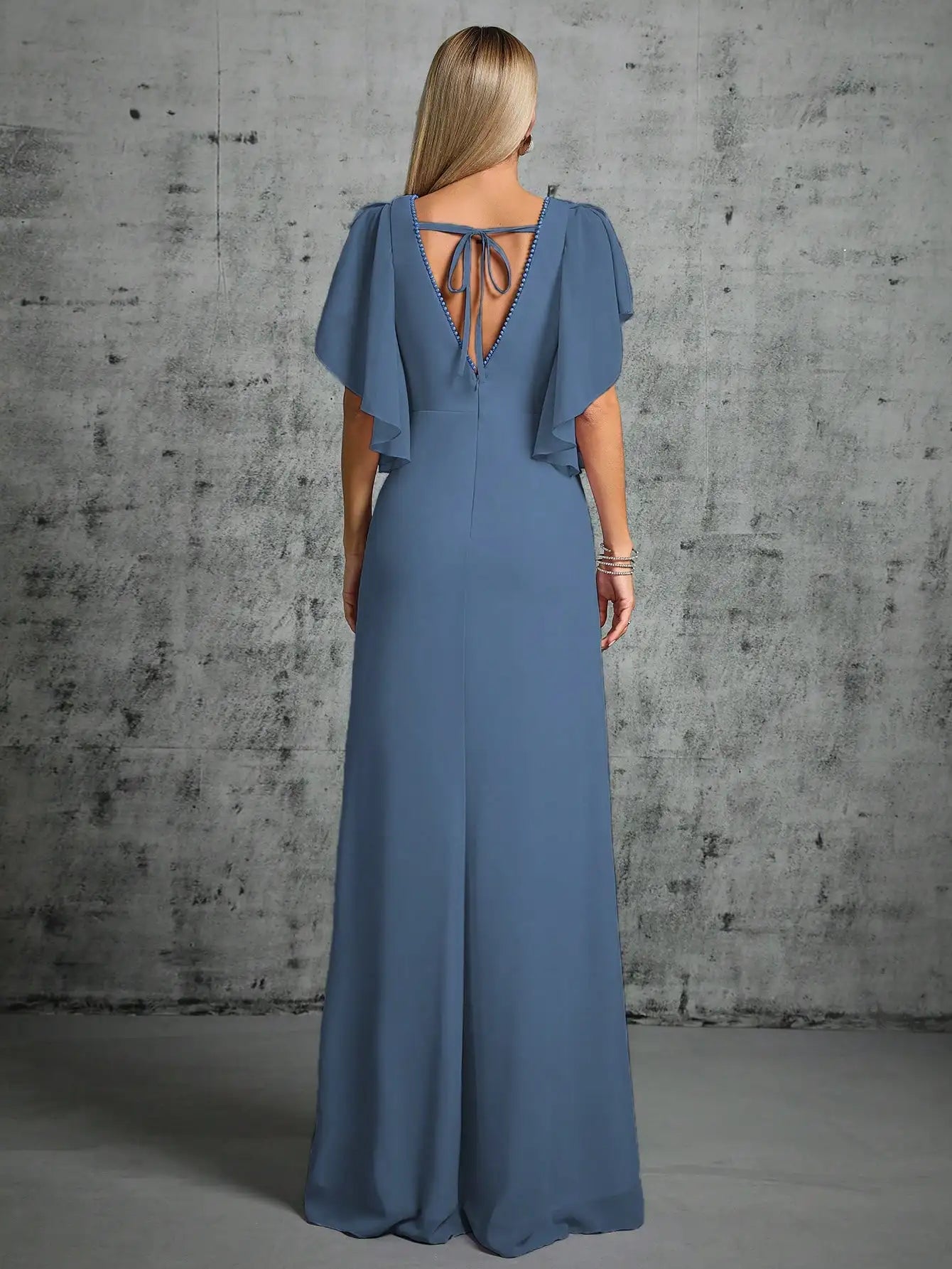 blue evening gown with soft flutter sleeves and fitted waist
