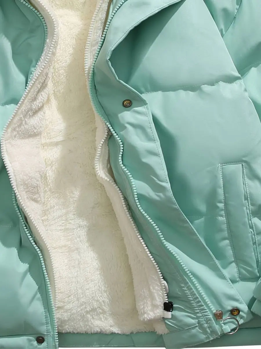 Close-up of a light blue womens jacket with white fur lining