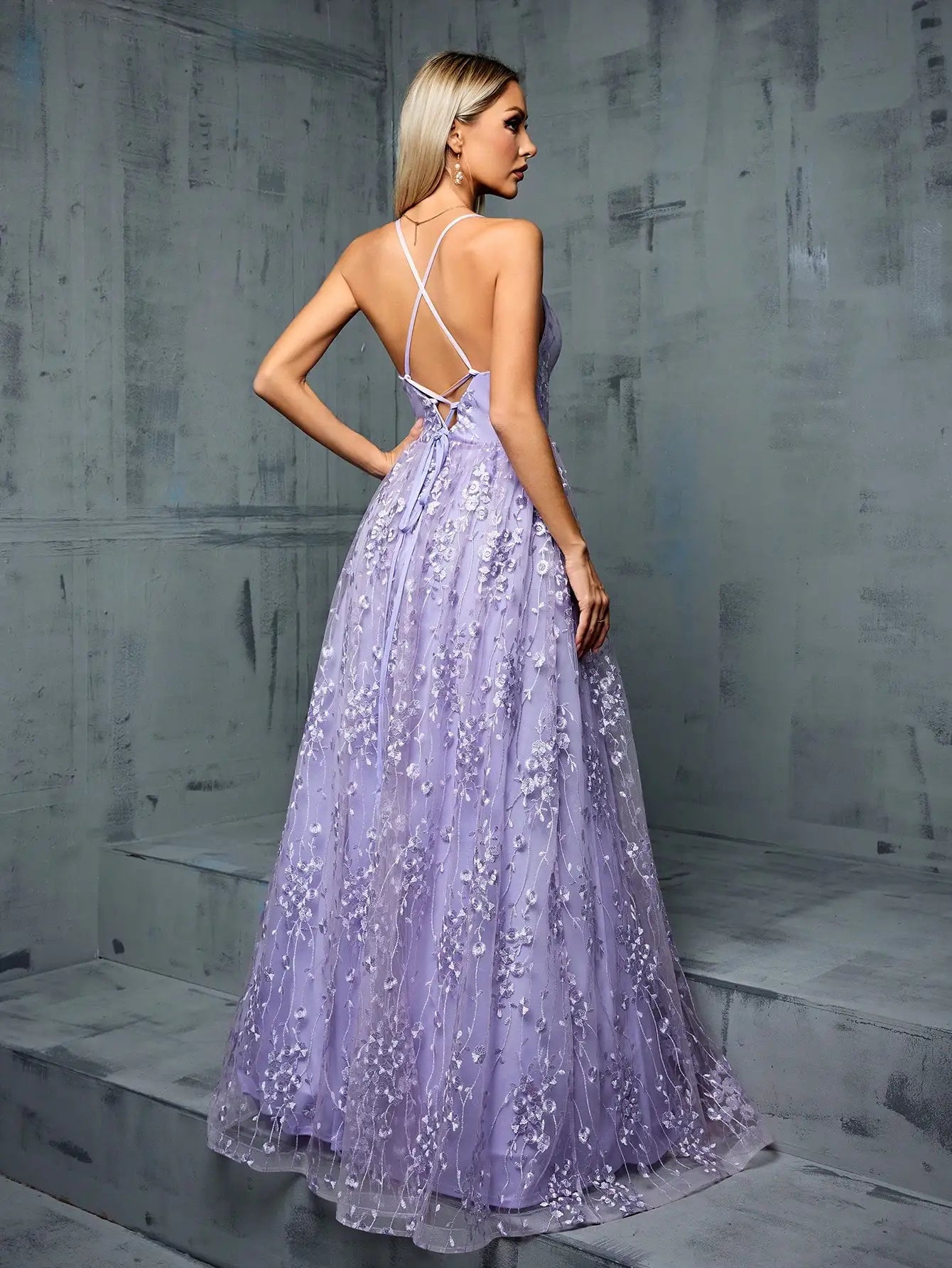 Lilac formal gown featuring floral embroidery and spaghetti straps
