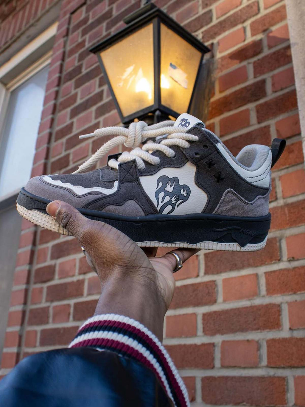 Logo detail on men’s grey suede chunky sneakers