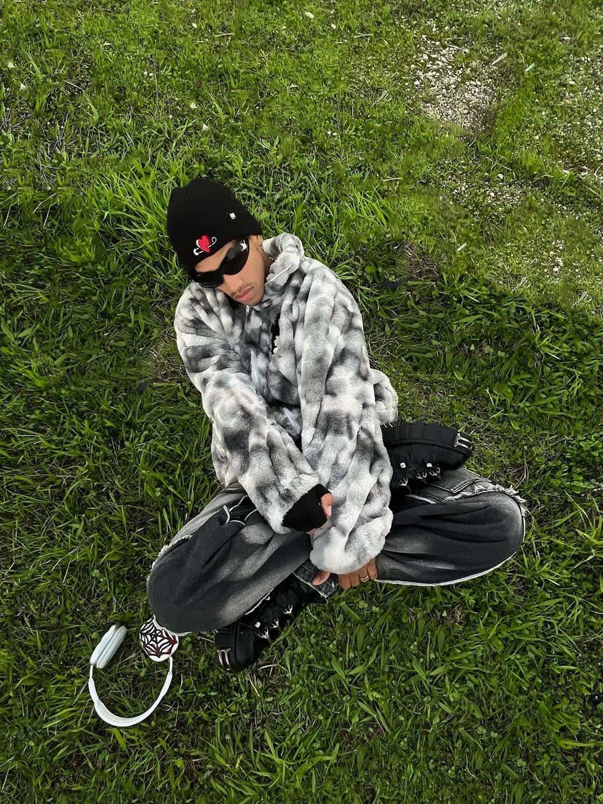 Pocket detail of men’s grey tie-dye faux fur jacket
