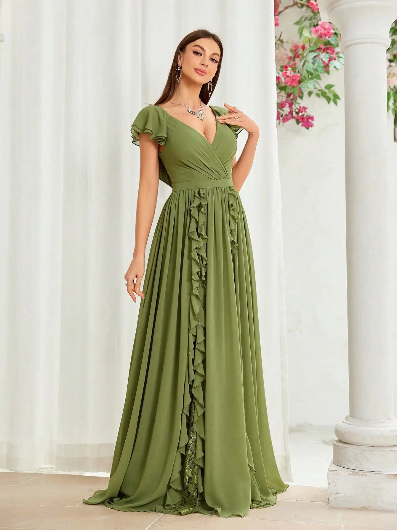 Model walking in olive green ruffle maxi dress for formal occasion
