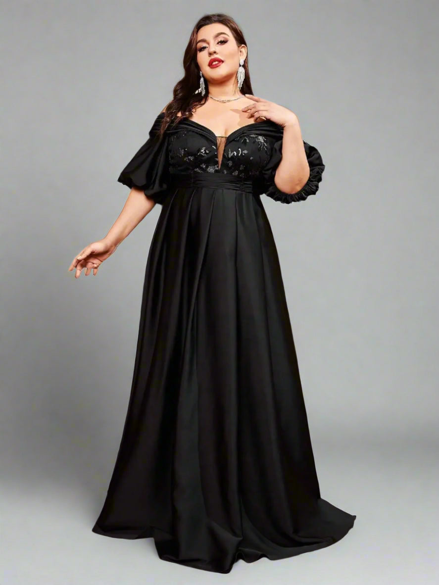 Front view of plus size black sequin formal gown with puff sleeves
