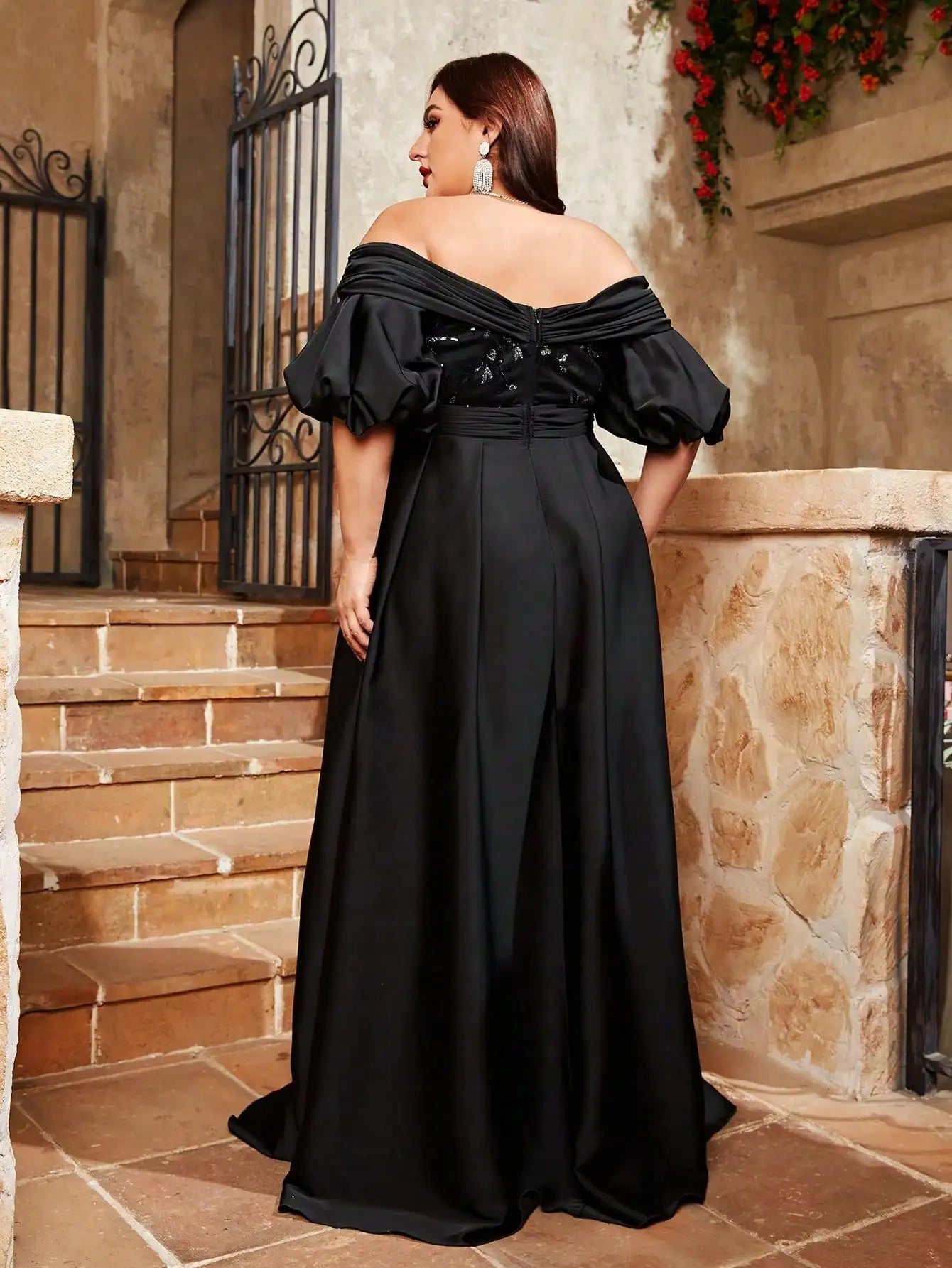 Back view of black puff sleeve evening dress in plus size fit
