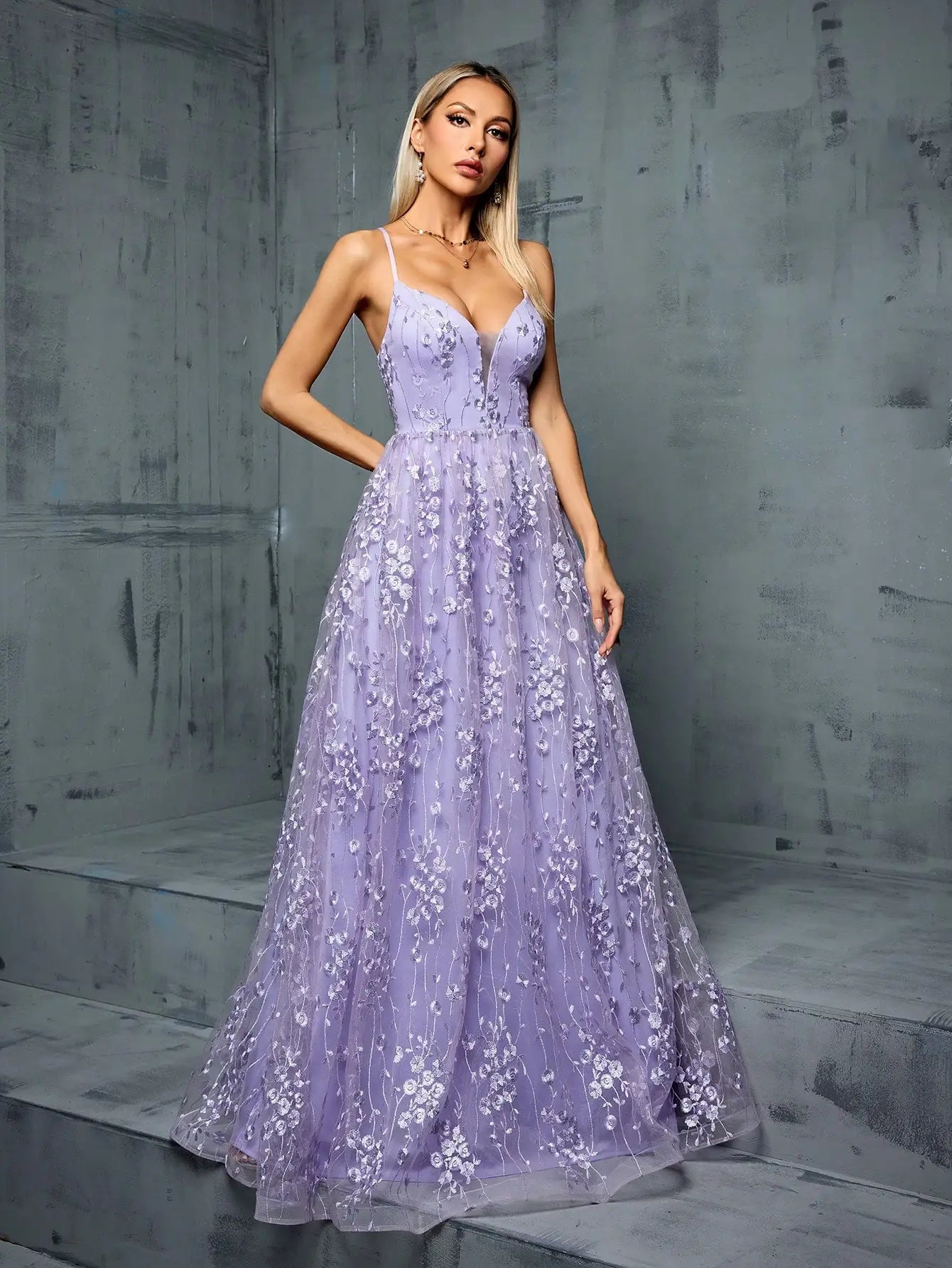 Spaghetti strap lavender ballgown with mesh insert and floral details