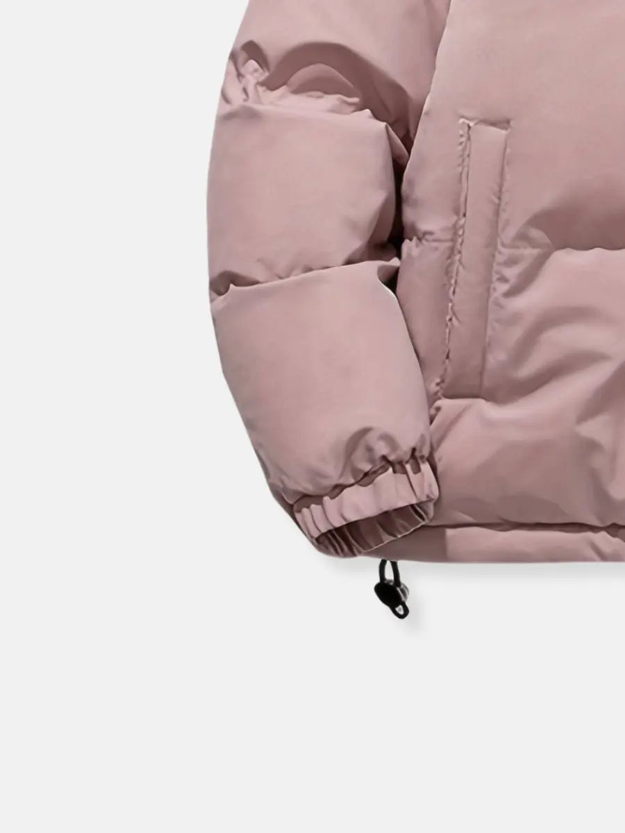 Close-up of a pink puffer jacket side pocket