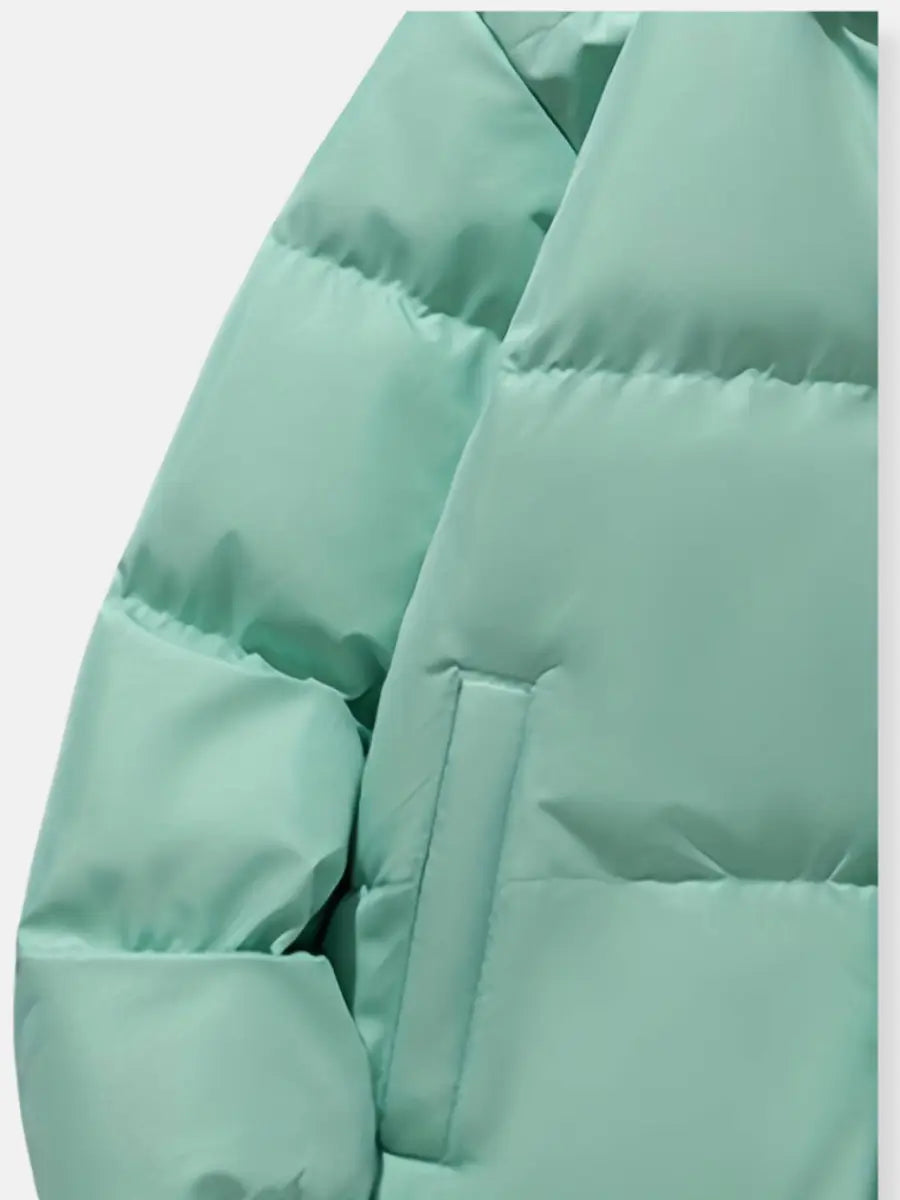 Close-up of a light green puffer jacket sleeve